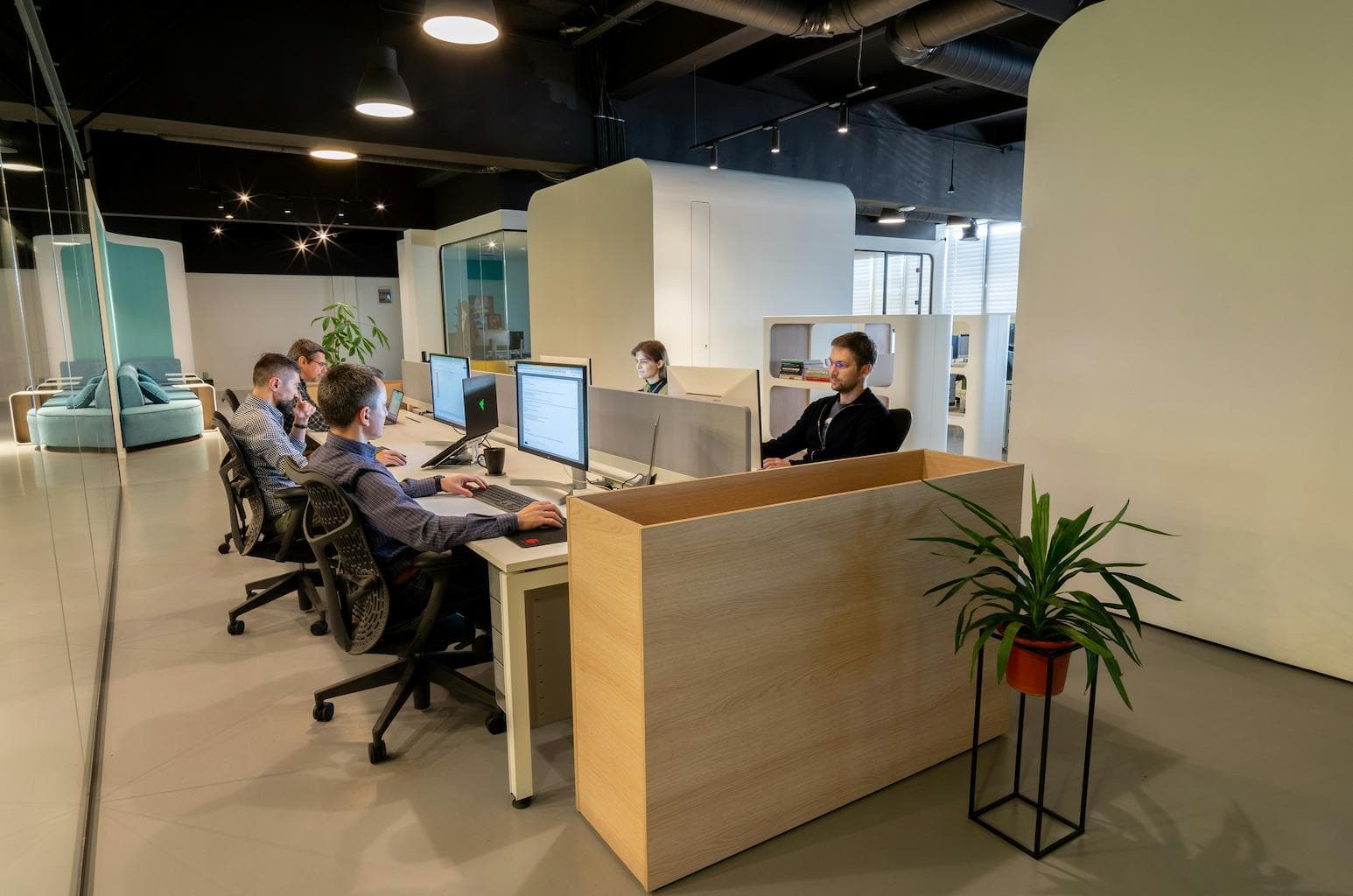 Software developers working on their computers in an office