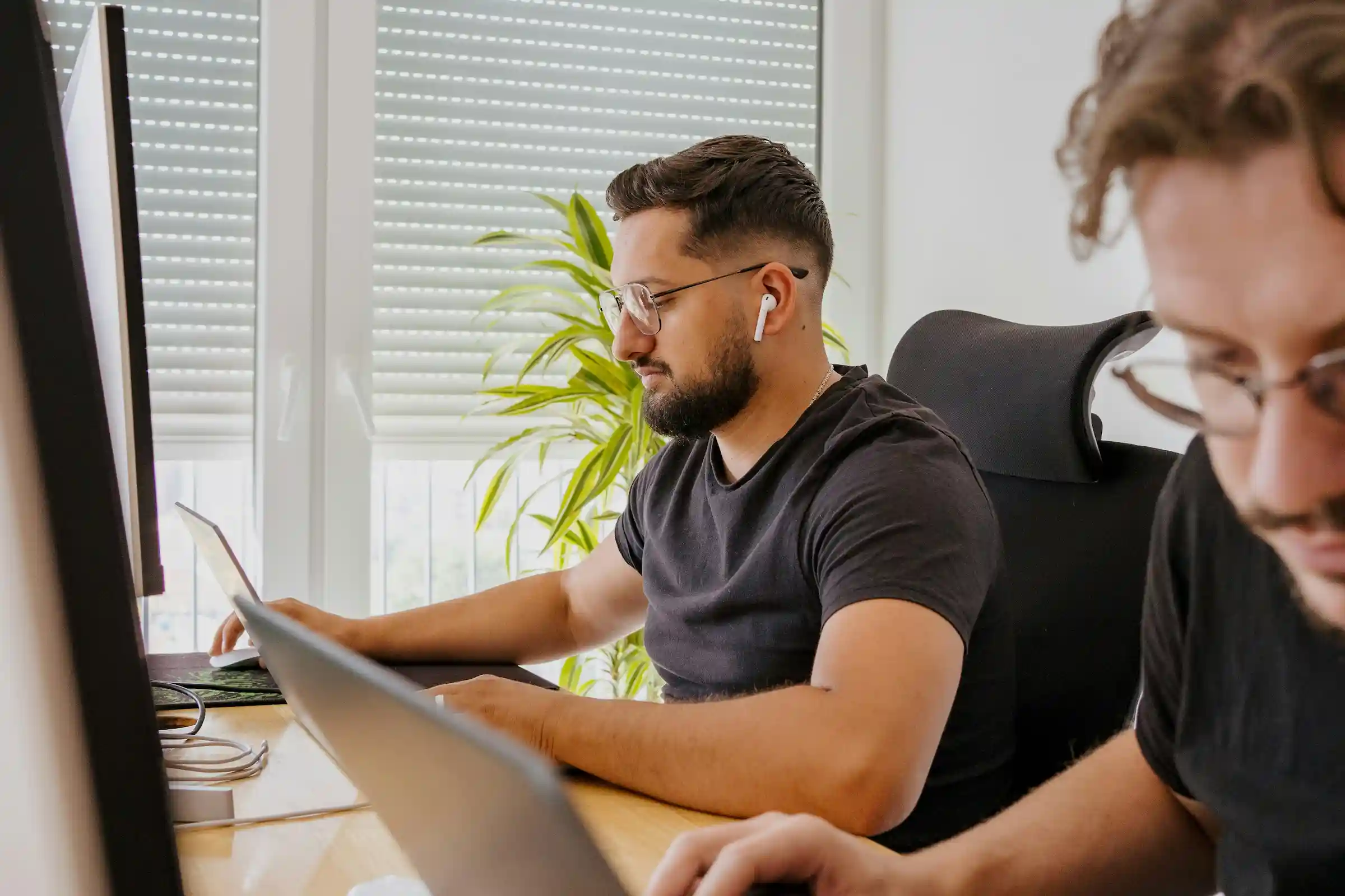 Team members having a discussion in an office lounge area
