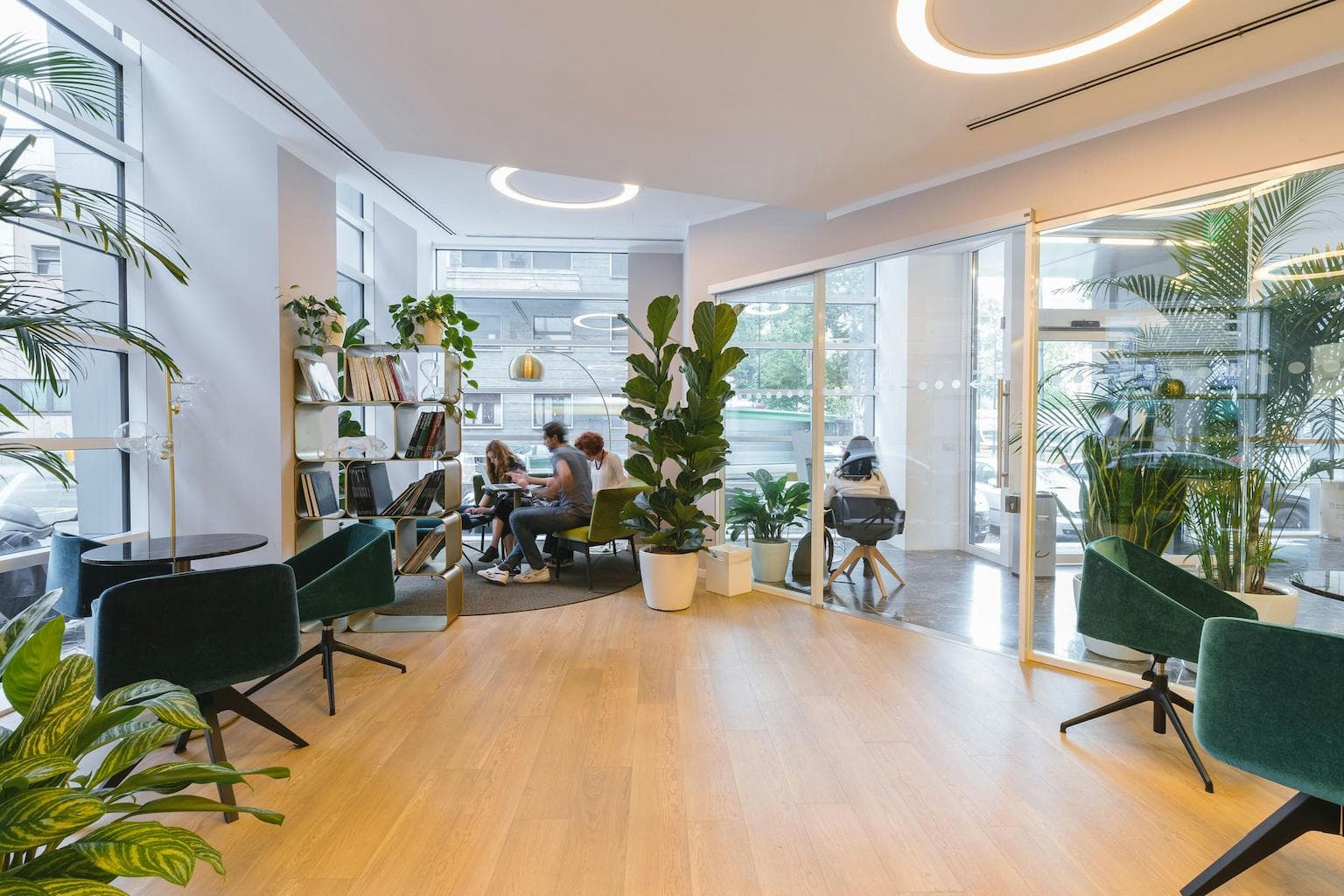 Team members having a discussion in an office lounge area