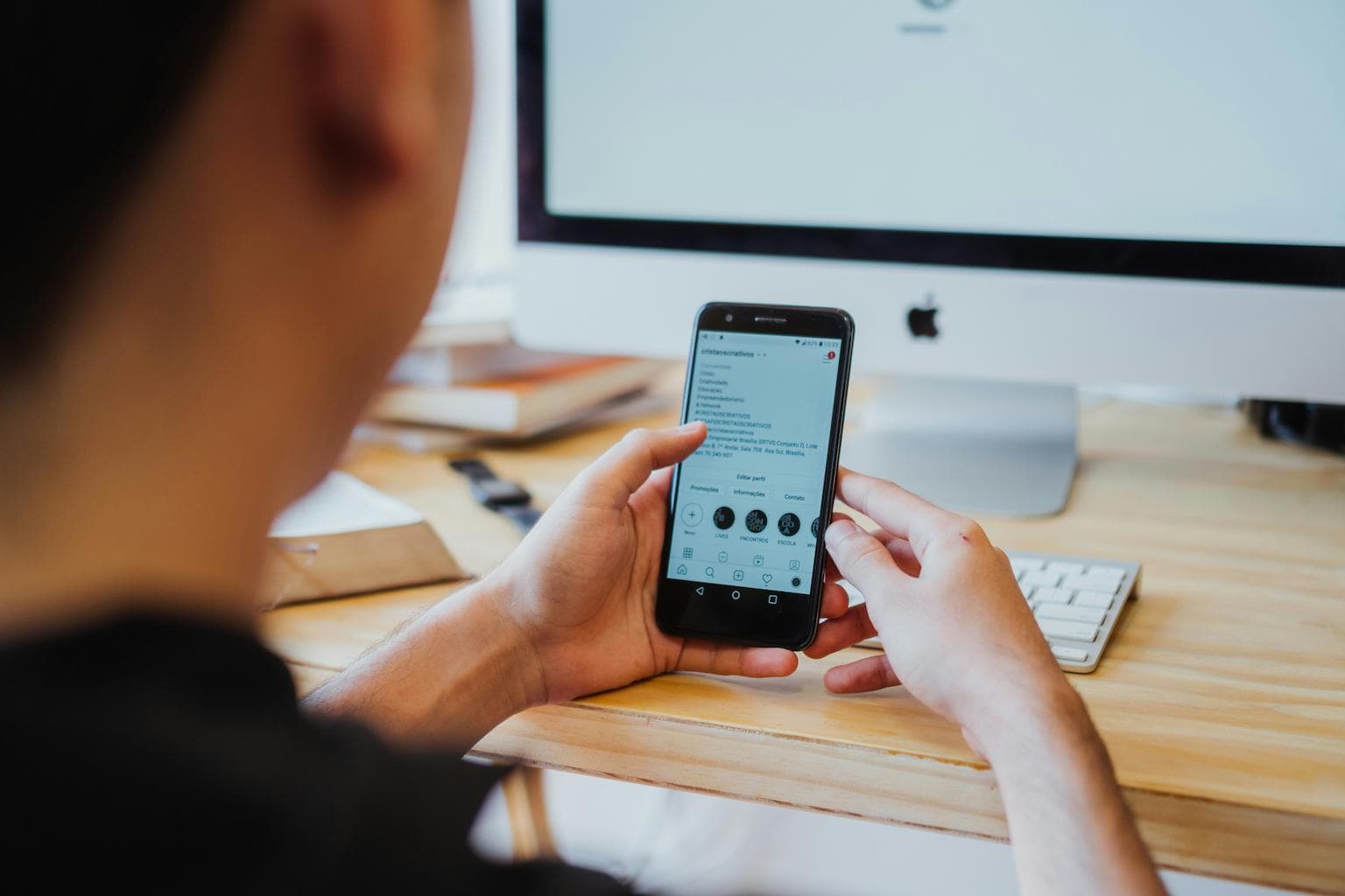 Mobile developer browsing a mobile app on a smartphone