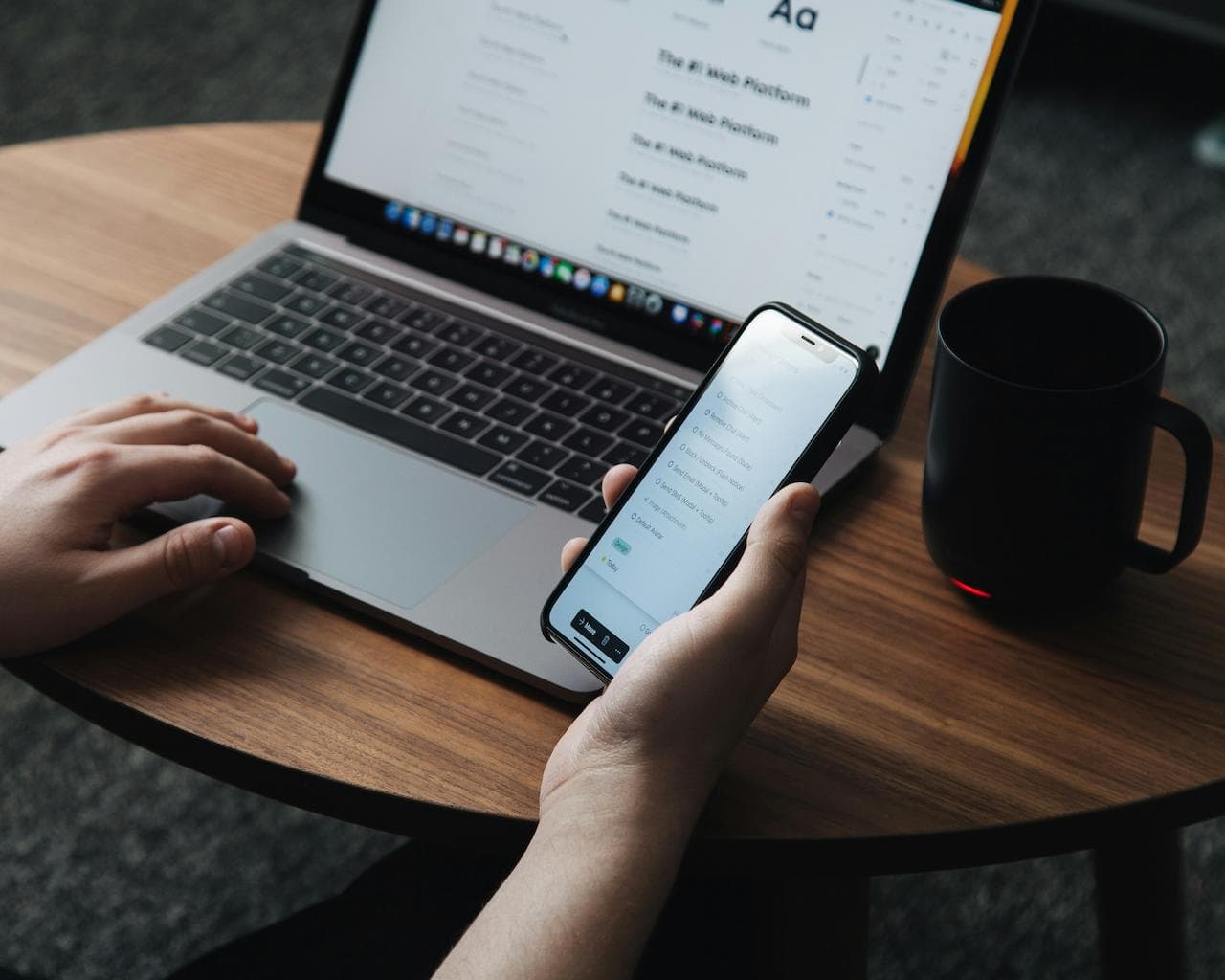 QA specialist testing a mobile app on a smartphone