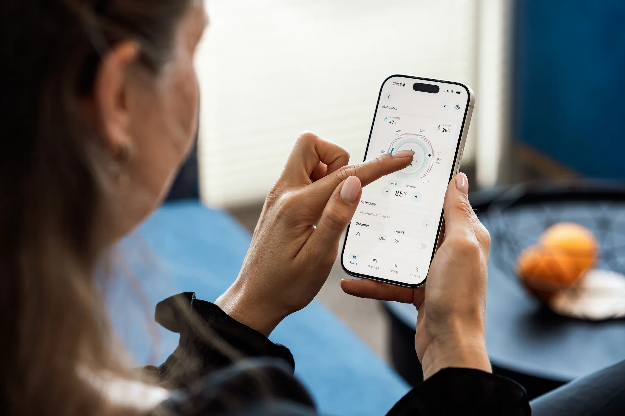 QA specialist testing a mobile app on a smartphone